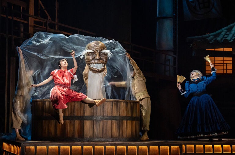 Mone Kamishiraishi as Chihiro and Romi Park as Yubaba in “Spirited Away,” directed by John Caird at the London Coliseum.