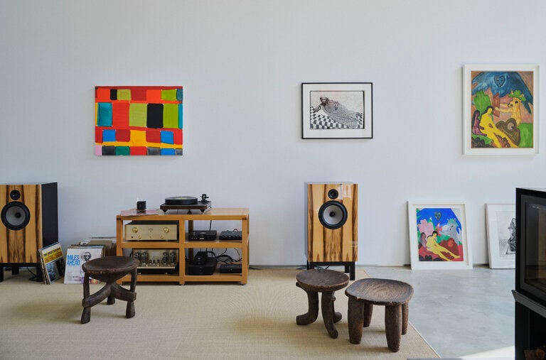 In the living area, a custom stereo and (from left) an oil panting by Whitney, a Seydou Keïta photograph and works on paper by Bob Thompson.