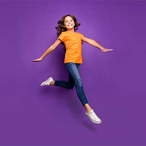 girl jumping on purple photography background